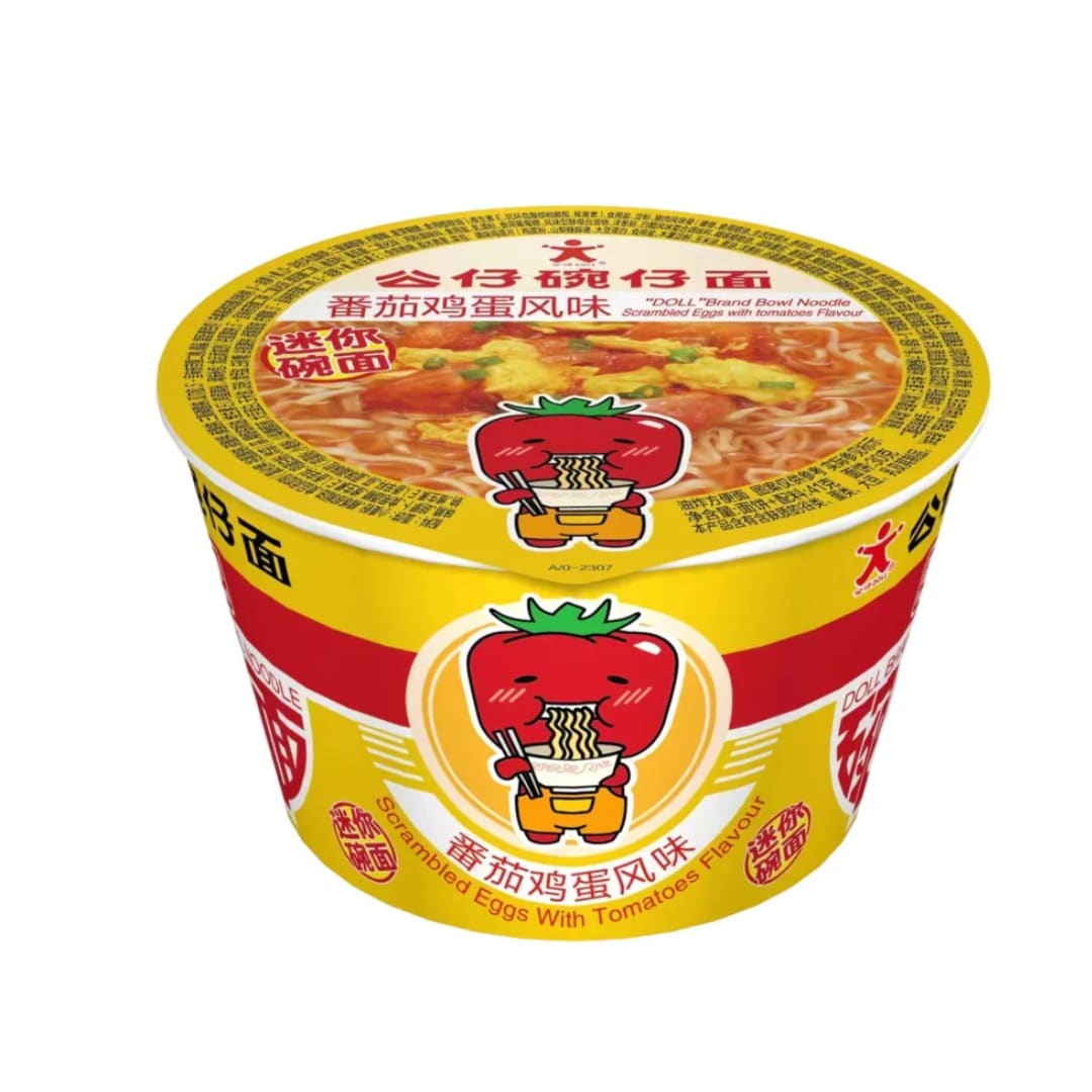Doll brand mini bowl noodles tomato egg | Snack Affair Archives Yellow instant noodle cup with a smiling cartoon tomato eating noodles; flavor: Scrambled Eggs with Tomatoes.