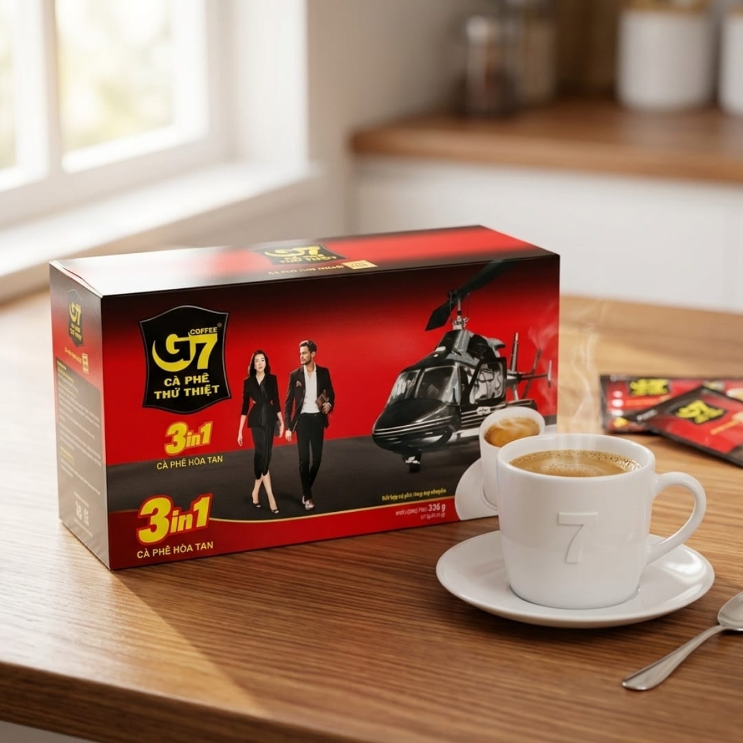 Trung Nguyen G7 3 in 1 Instant Coffee 21 Sachets 1 | Snack Affair Archives Red G7 3-in-1 coffee box on a wooden table beside a white cup of coffee on a saucer