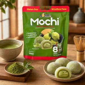 Close-up of green Mochi packaging on a wooden table, surrounded by bowls of matcha powder and mochi treats.