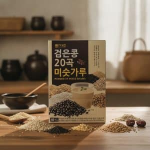 Archives Box labeled 'Powder of Mixed Grains' with Korean text, on a wooden table, surrounded by piles of various grains and a glass of grain drink nearby.