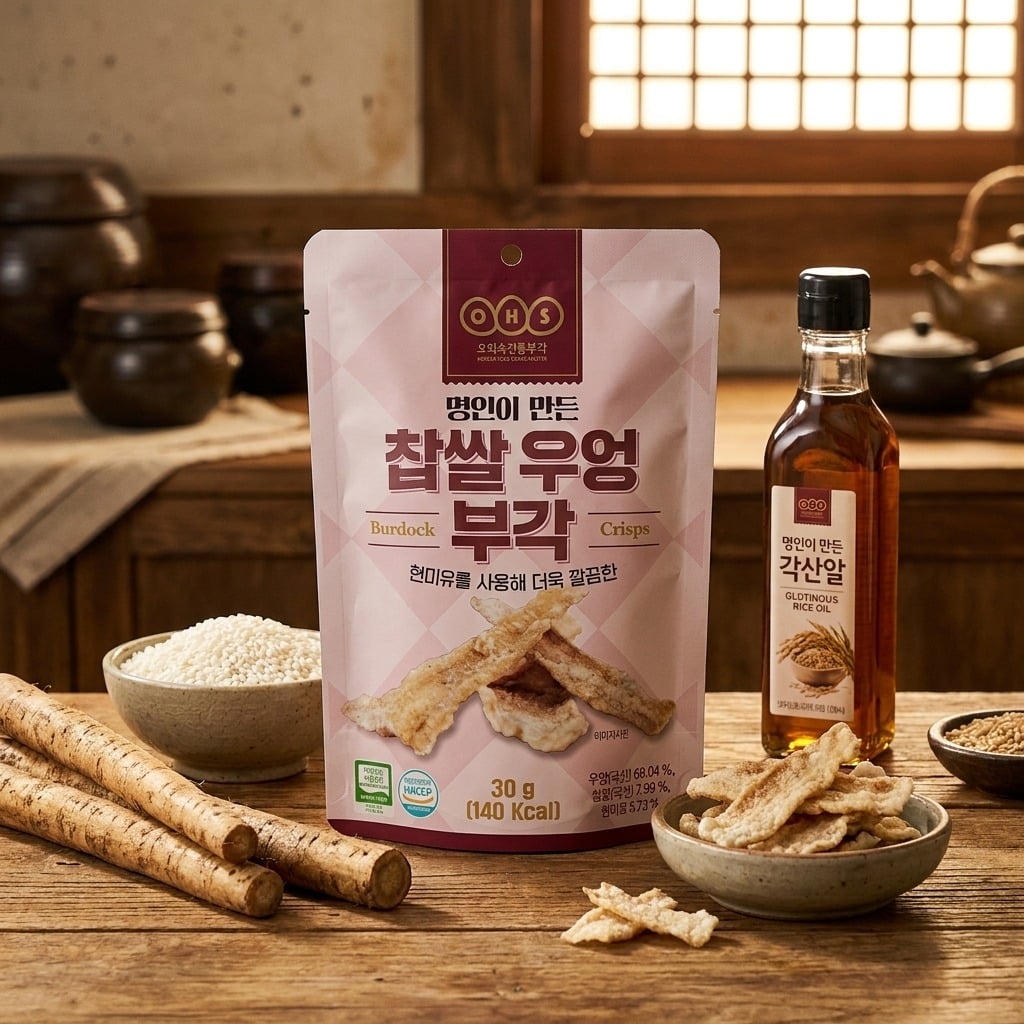 ohsburdockcrisps30glifestyle | Snack Affair Archives Pink package of burdock root crisps on a wooden table, surrounded by bowls of chips, sesame sticks, and a bottle of oil in a rustic kitchen setting.