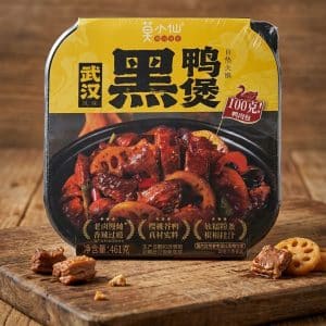 Archives Packaged Chinese braised duck with lotus root and peppers on a yellow box, sitting on a wooden board (net weight 461 g).