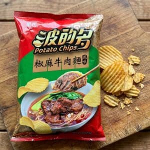 Red and green bag of beef-flavor potato chips with Chinese characters, featuring a bowl of beef noodle soup on the front.