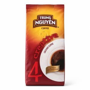 Bag of Trung Nguyen coffee with orange-yellow packaging and bold red logo reading 'TRUNG NGUYEN'