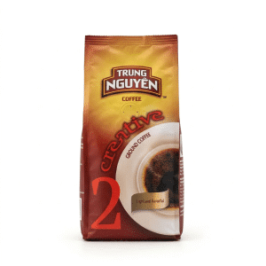 Bag of Trung Nguyen Creative 2 ground coffee with a coffee cup graphic on orange-brown packaging, standing upright on white background